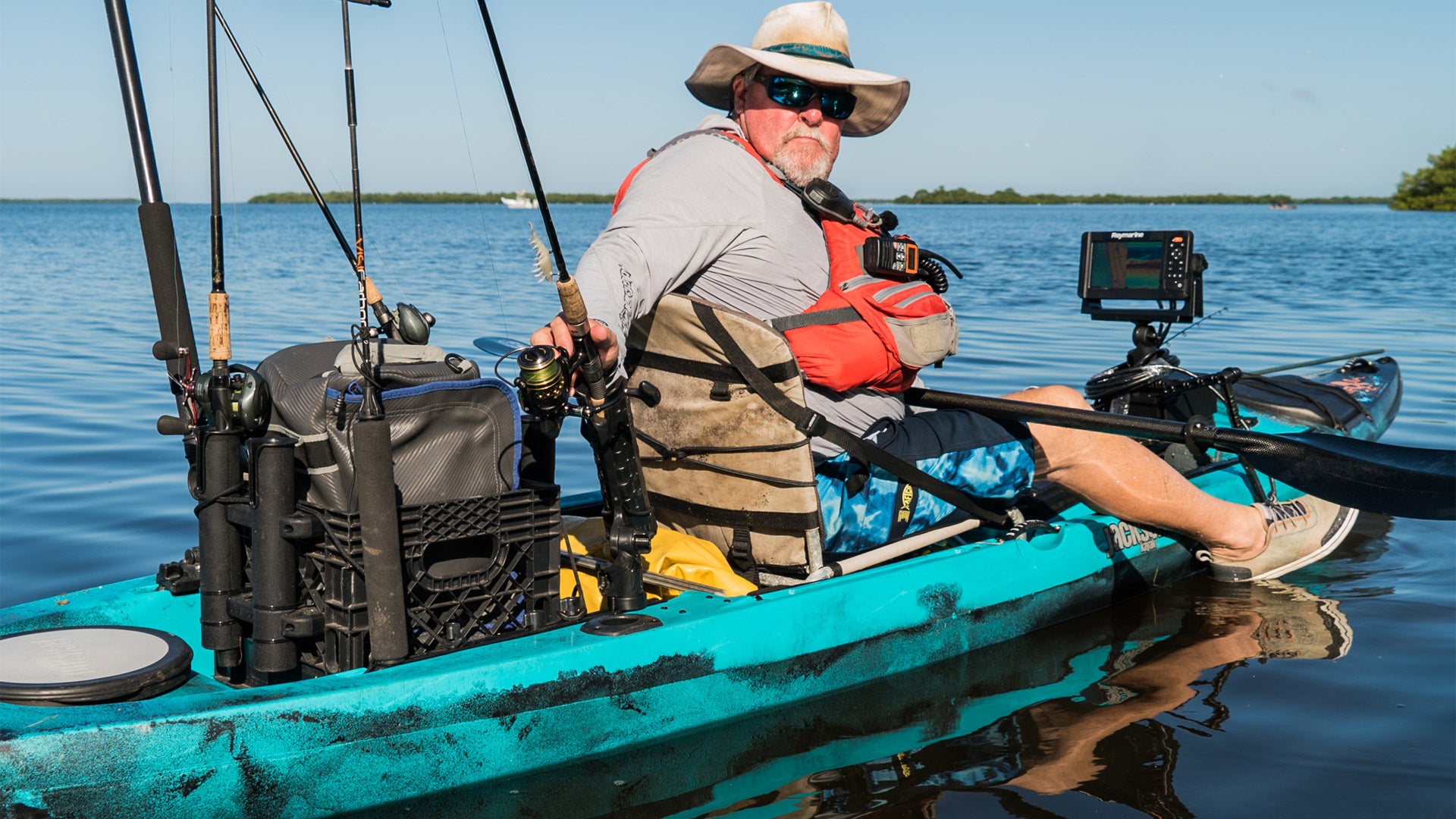 Fisherman With Radio Mounted on Jacket